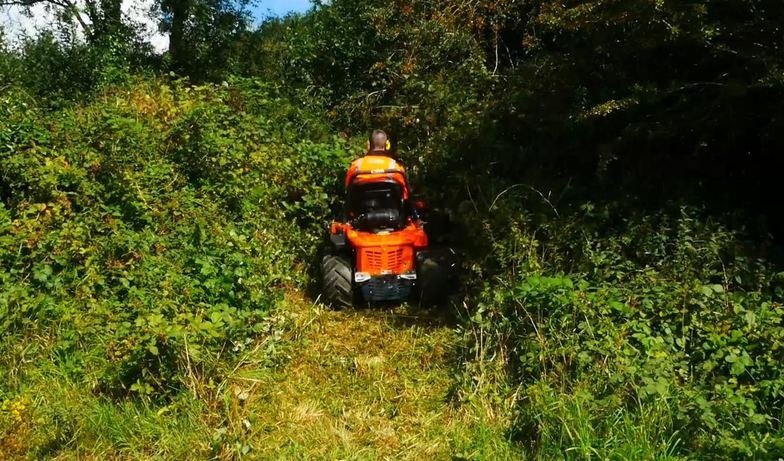 Overgrown Mowing 4x4 flail mower working through dense scrub